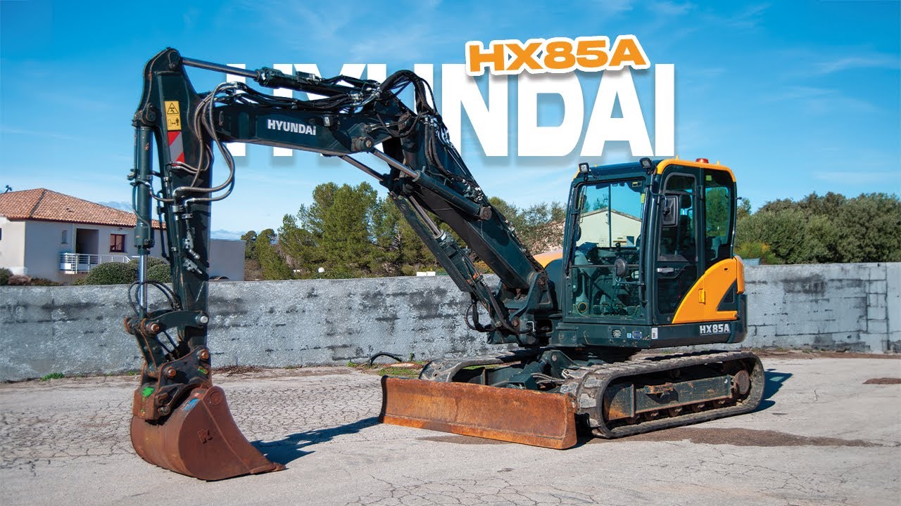 PRÉSENTATION PELLE SUR CHENILLES HYUNDAI HX85A