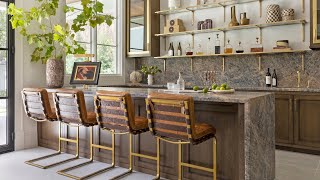 Tour An Open Concept Home Bar with Open Shelving, an Integral Sink and Waterfall Countertop