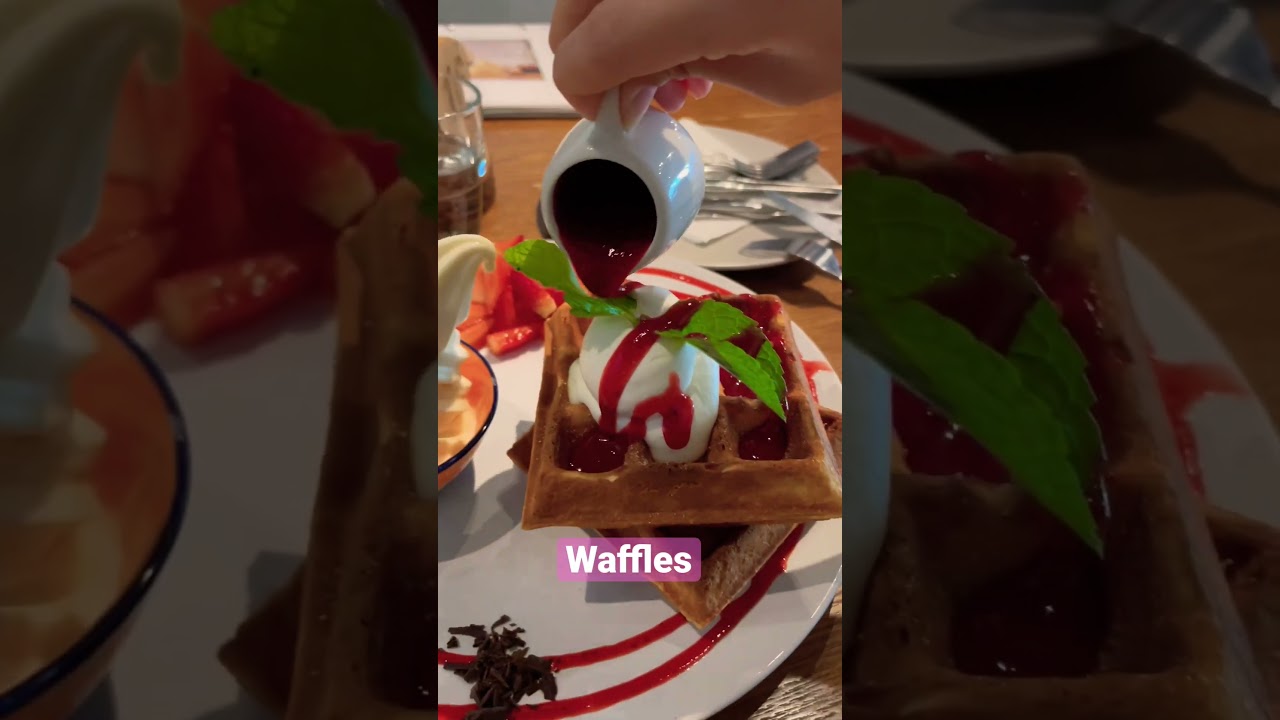 Delicious waffles with strawberries and ice cream. 
