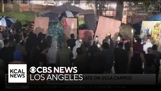 Chaos on the UCLA campus as protestors break down the walls of pro-Palestine encampment