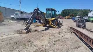 2006 Volvo BL 70 Backhoe Loader digging...