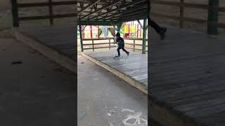 Boy rides scooter off ledge then falls forward and faceplants