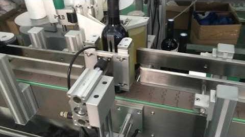Red wine bottle first side labeling machine video