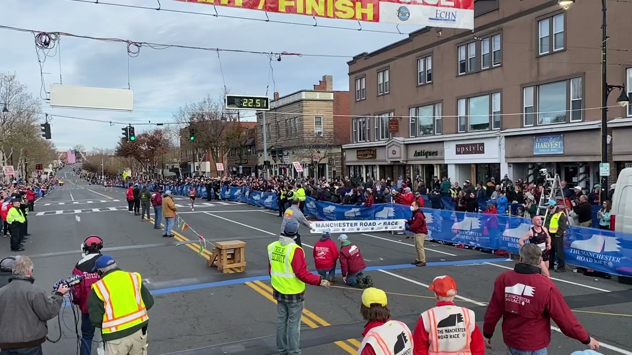 Weini Kelati finishing her record-breaking run at the 85th Manchester Road Race