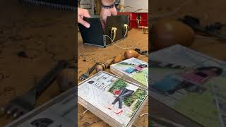 time-lapse of hand stitching a green English bridle leather square handbag