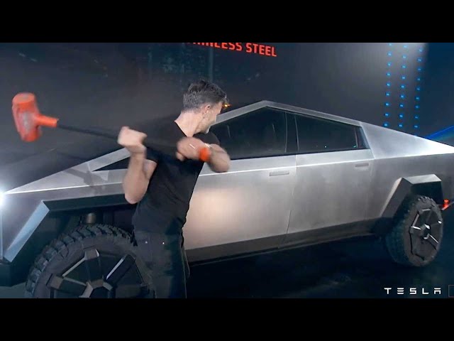 Elon Musk demonstrates Bulletproof, Sledge Hammer Resistant CyberTruck class=