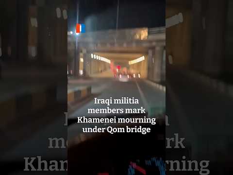 Iraqi militia members mark Khamenei mourning under Qom bridge