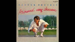 Silver Pozzoli – “From You To Me” (Germany ZYX) 1987
Written by Graziano Pegoraro and Naimy Hackett. Produced by Stefano Scalera and Graziano Pegoraro.
From the album, “Around My Dream”.
Hailing from Milan, Italy, Silver began his recording career as a member of Clubhouse, with whom he enjoyed a worldwide hit with the Do It Again Medley with Billie Jean in 1983.
Going solo, he scored European wide hits with “Around My Dream” and “Step By Step” – both included on this German release on ZYX. Silver mostly recorded for the Milan based Many label and did so up through the mid-90s.
Hailing from Long Island, NY, co-writer, Naimy Hackett was an active songwriter on the Italo Disco scene. Baltimora’s #13 US hit from 1985, “Tarzan Boy” (UK, #3) was one of her compositions. Silver Pozzoli – “From You To Me” (Germany ZYX) 1987