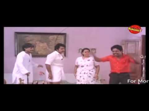 mazha-peyyunnu-maddalam-kottunnu-malayalam-movie-comedy-scene-sreenivasan-and-mohanlal