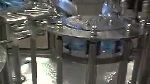 Máy xúc rửa, chiết rót và đóng nắp chai PET tự động/ dây chuyền chiết rót nước suối, nước trái cây