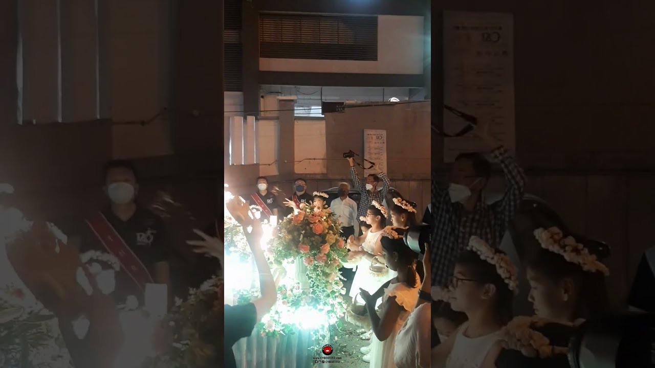 a religious procession at Catholic Church of The Holy Rosary for it’s 120th year celebration