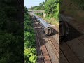 Amtrak under low bridge