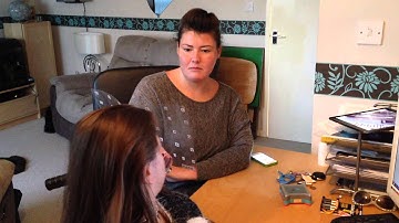 Lisa using her EyeLink communication system