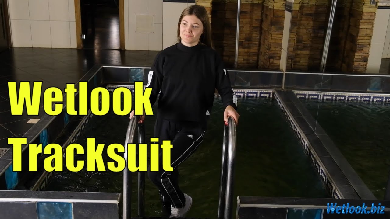 Wetlook girl in a tracksuit swims clothed in the pool | Wetlook sweatshirt | Wetlook sweatpants