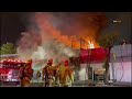 Downtown: Over 100 firefighters have responded to a *two-story* row of commercials on fire in ...