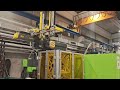 Samfacc IML robot for 3 side container labeling. #injectionmolding#iml #imlsolution #engel