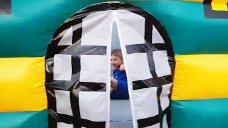 Outdoor playground fun for kids with bouncy castle. Video 2016