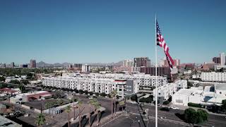 Drone flying the American Flag Phoenix Skyline
