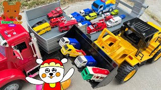 Big Wheel Loader Loads Small Cars Onto The Red Truck.