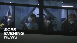Americans quarantined on cruise ship in Japan begin returning home
