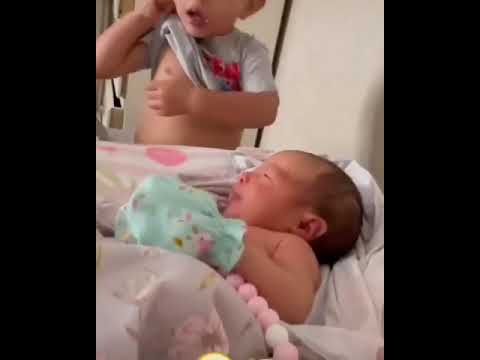 BABY TRYING TO BREAST SISTER WITH ITS OWN BREAST