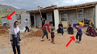 A nomadic family's effort to complete the roof of the house on a rainy day