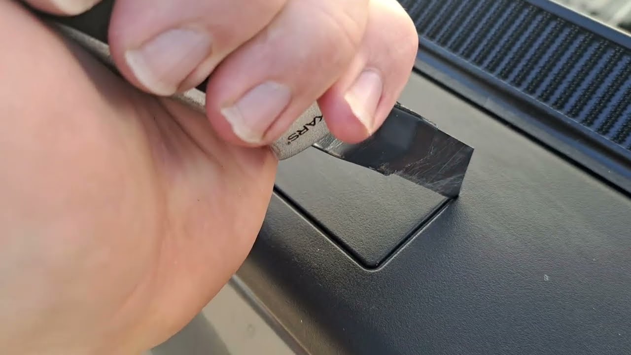 Removing the stake pocket covers from Truck bed