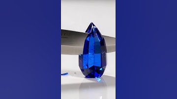 Slicing blue sapphire shaped like a rocket 🚀