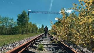 Alone man walking on railway track - Copyright Free Video
