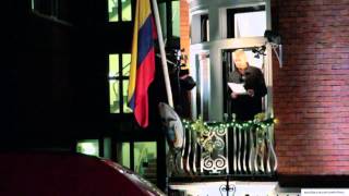 Julian Assange speaks from balcony of Ecuadoran embassy marking 6 months
Julian Assange marked 6 months circled by British police in the Ecuadoran embassy by speaking from the balcony of the building last night (Dec 20th.) Those gathering in solidarity adopted a festive theme with carols, candles, sharing food and wine. Crowd included included journalist John Pilger, VeteransforPeace, members of the Ecuadoran Community, people who had flown from German and driven from Manchester. A 6 month daily solidarity vigil continues @embassy 3-5pm Julian Assange speaks from balcony of Ecuadoran embassy marking 6 months