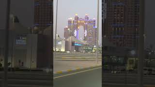 The Rixos Marina is a luxury waterfront resort with rose-gold twin towers & a dramatic skybridge