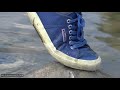 Wetlook - Laura in river with Superga, jeans and sweater