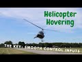 The Key To Helicopter Hovering: Smooth Control Inputs