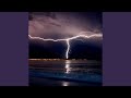 Rain with lightning and thunder storm over the ocean