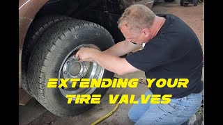 Make your truck's dually rear inner tire valves accessible from the outside tire.