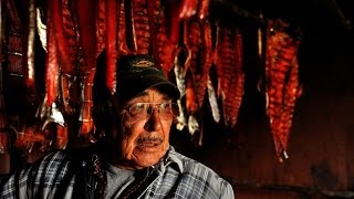 At Kuskokwim River fish camp, smokehouses fill with fish and tradition