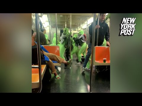 VIDEO: Female menaces in bizarre neon leotards attack Times Square straphangers | New York Post