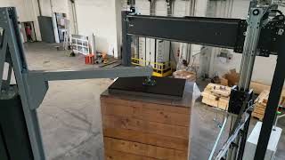 Automatic packaging machine with top sheet dispenser