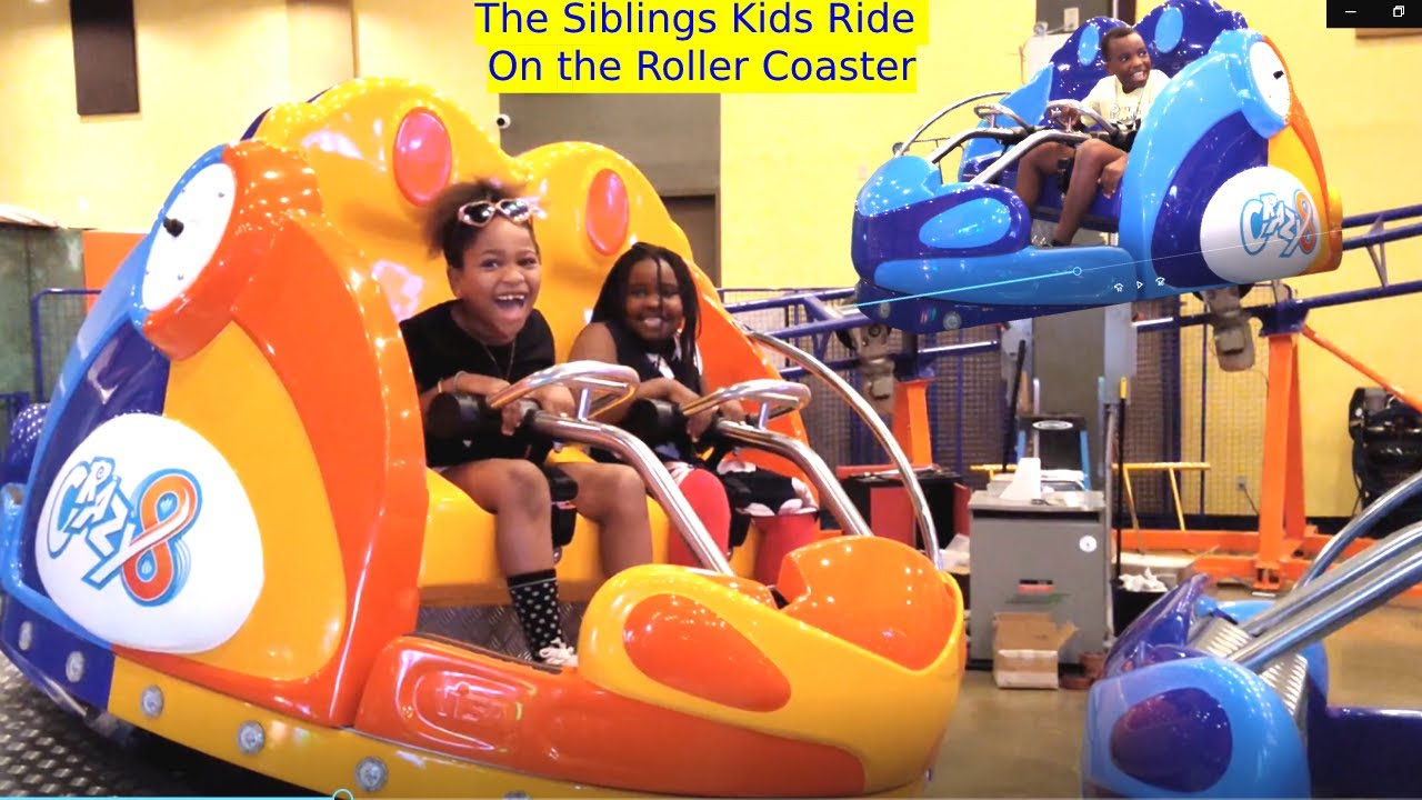 The Siblings Kids ride on the roller coaster and bumper cars toys at