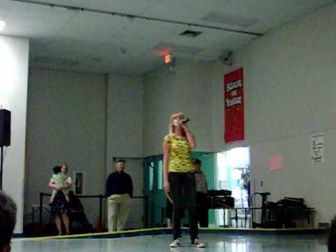 Melissa singing "The Climb" at the Talent Show