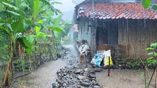 Heavy rain pours down on the Indonesian village||natural rain floods the tin roof||time to sleep