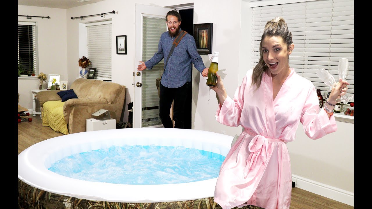 WIFE SURPRISES HUSBAND WITH HOT TUB IN LIVING ROOM! photo