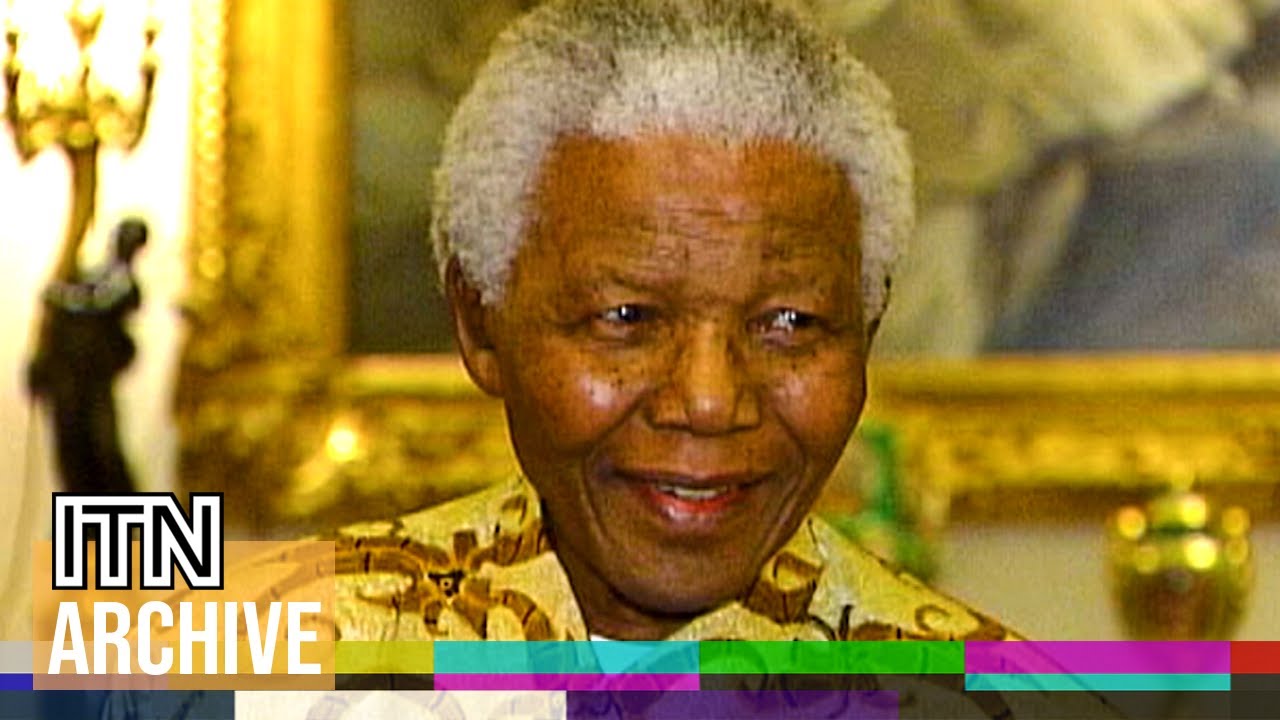 Nelson Mandela Makes the Queen Laugh with Unusual Greeting (2003)