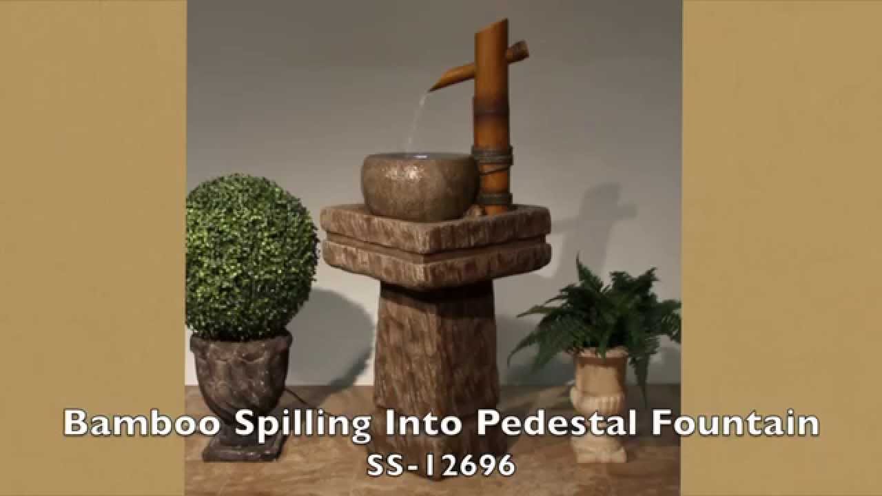 Bamboo Spilling Into Pedestal Fountain