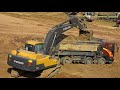 Volvo EC250DL Excavator Digging Loading Deawoo Dump Truck. 1080HD Video.