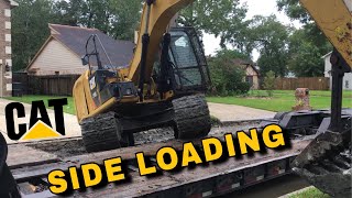 Side loading CAT excavator onto RGN lowboy trailer