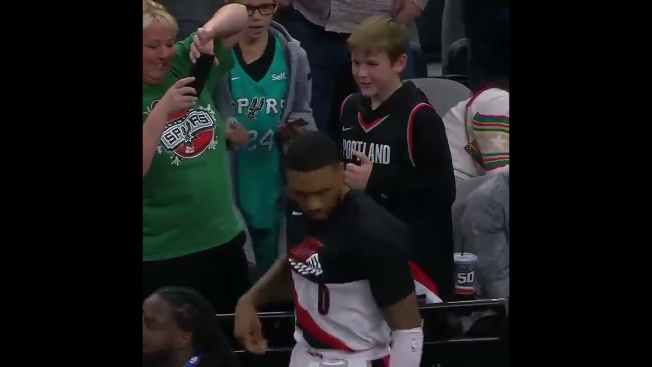 Damian Lillard giving autograph for a fan