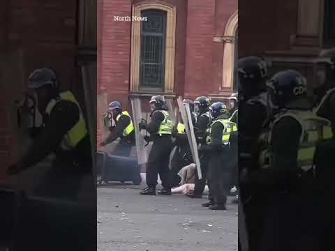 Moment woman shoves bin towards cops before falling flat on her face as she admits violent disorder