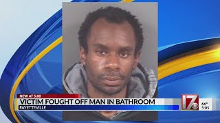 Fayetteville man charged with peeping in bathroom stall, threatening to kill woman