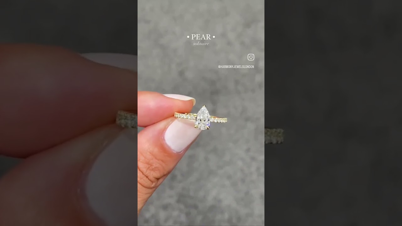 Pear Shape Engagement Ring with diamonds on the shoulders